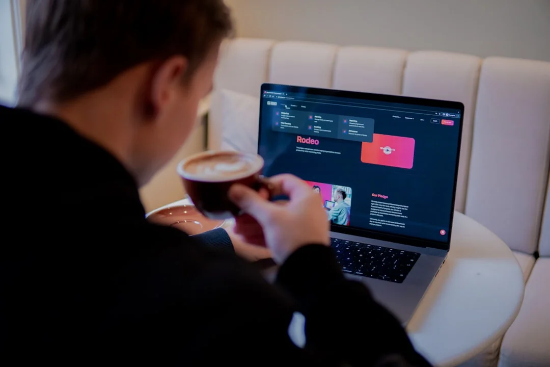 gallery-6 Person using smartphone for stock market analysis at home office.